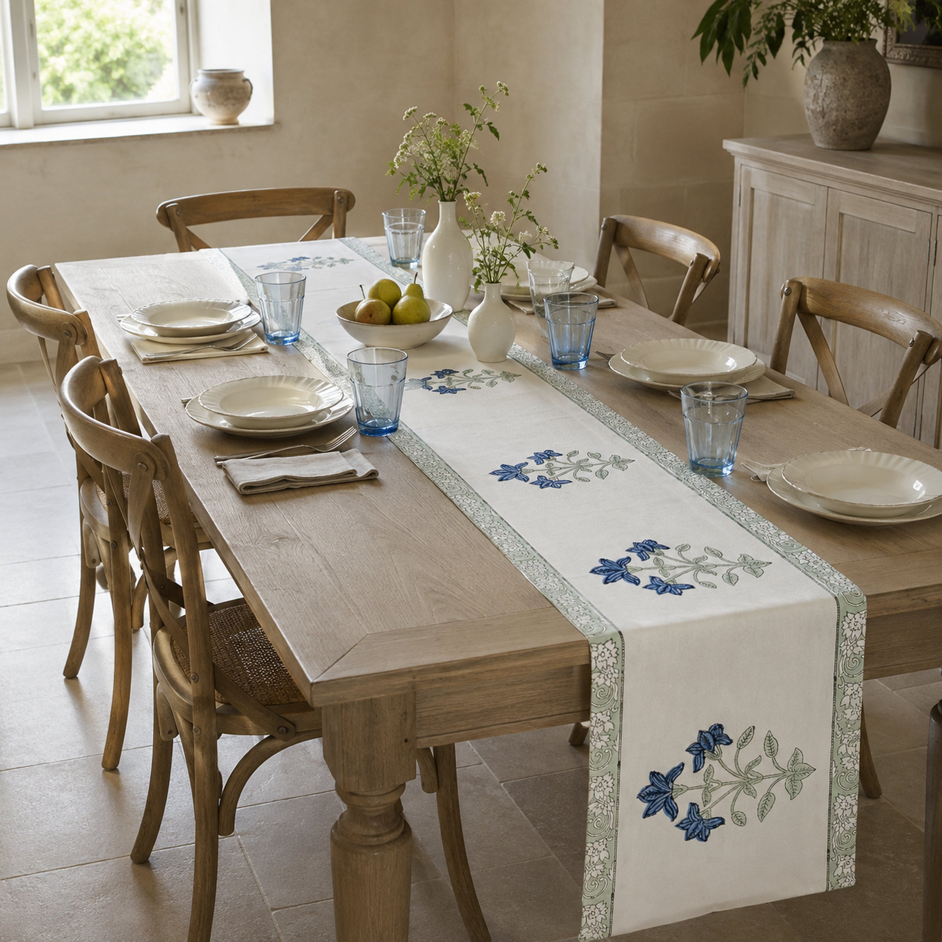 Blue Lily Sage Border Table Runner, styled on a dining table.