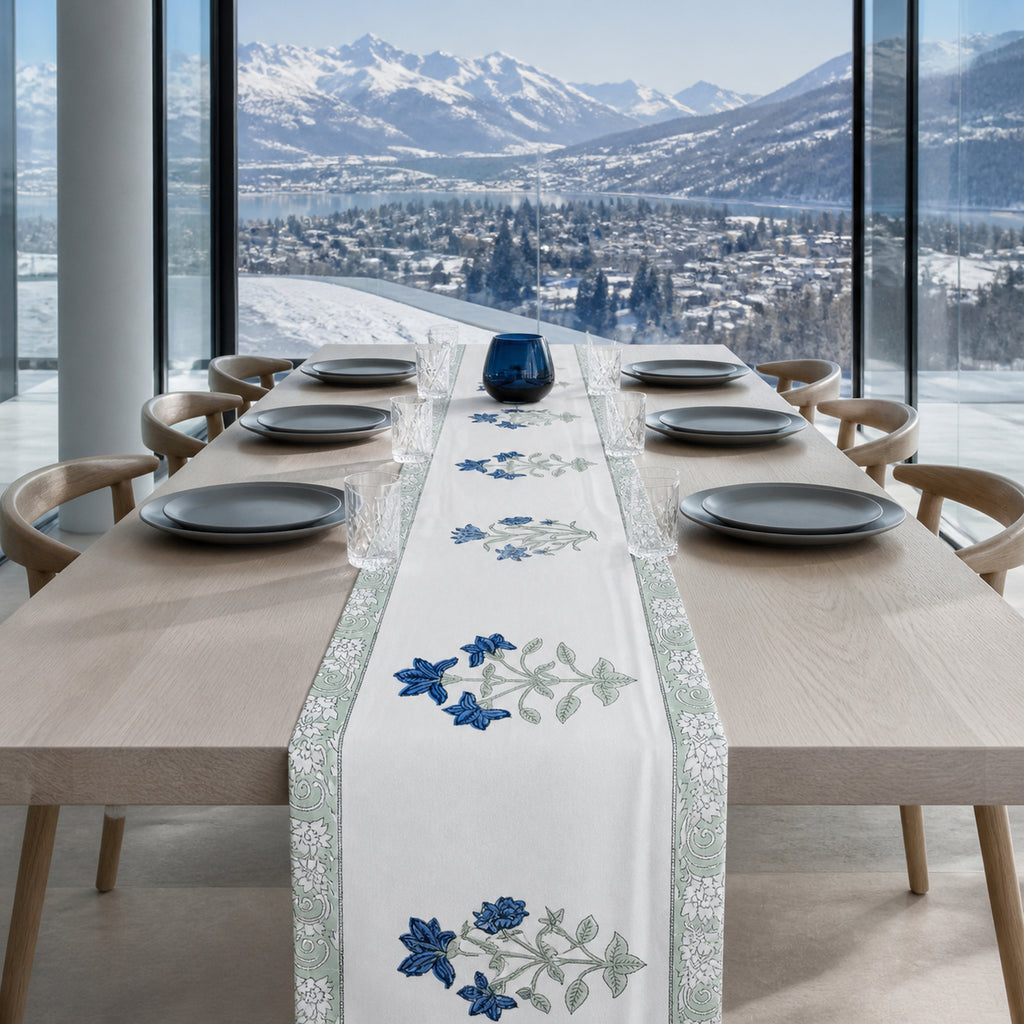 Blue Lily Sage Border Table Runner, styled on a dining table.
