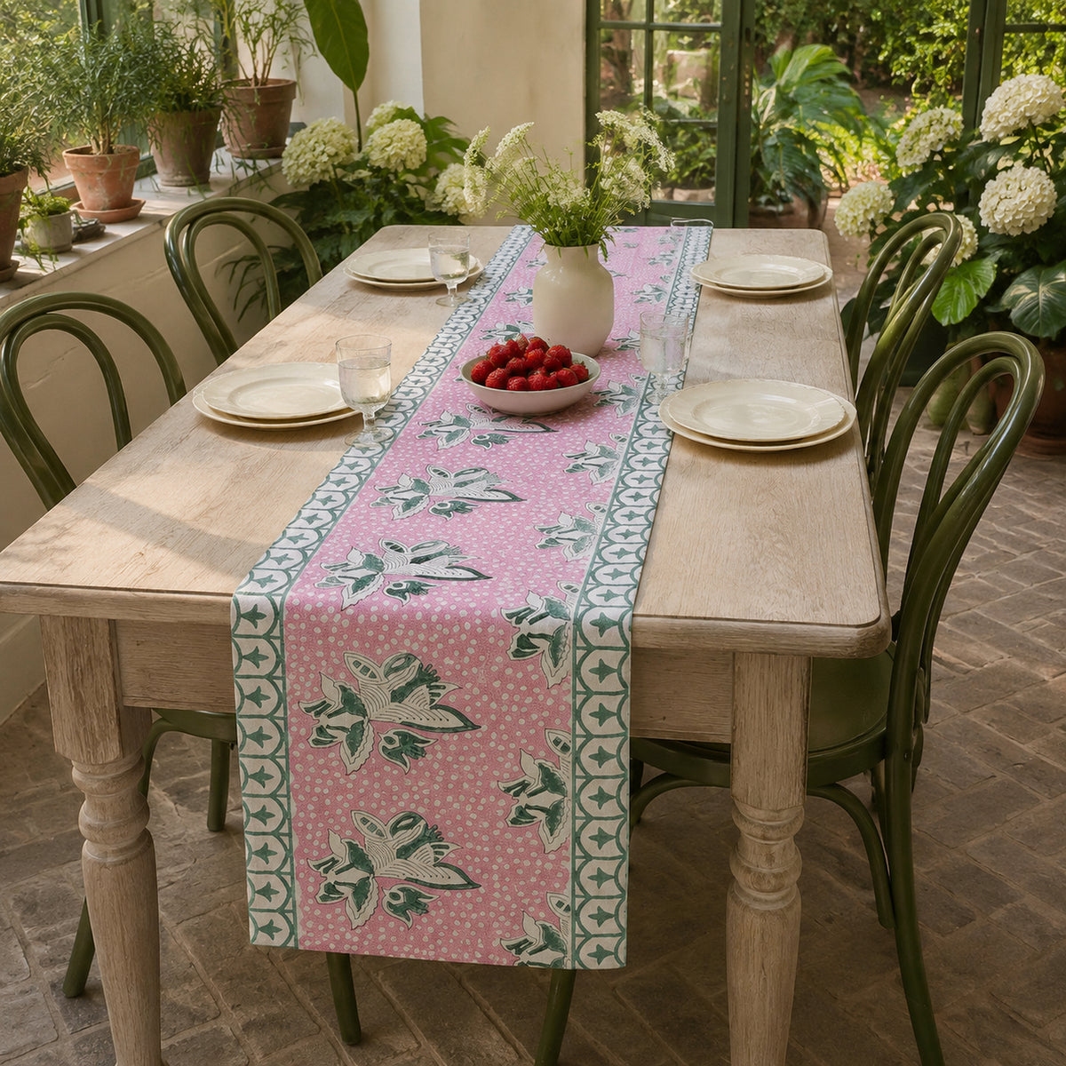 Pink Lily Teal Border Table Runner, styled on a dining table.