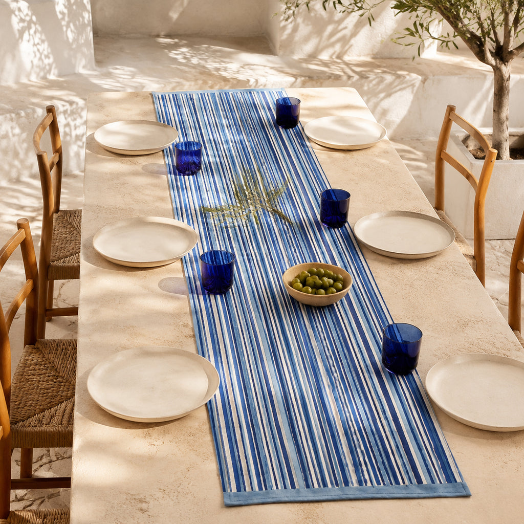 Indigo Stripe Table Runner, styled on a dining table.
