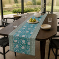 Teal Lotus Vine Table Runner, styled on a dining table.