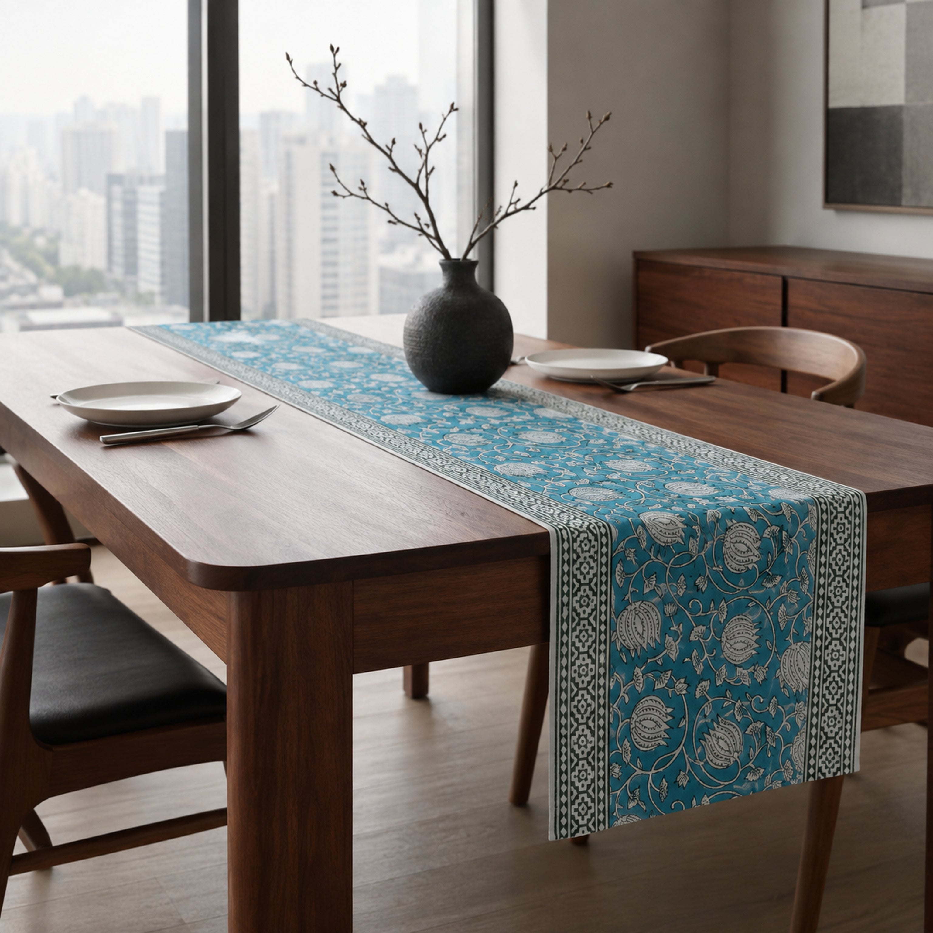 Teal Lotus Vine Table Runner, styled on a dining table.