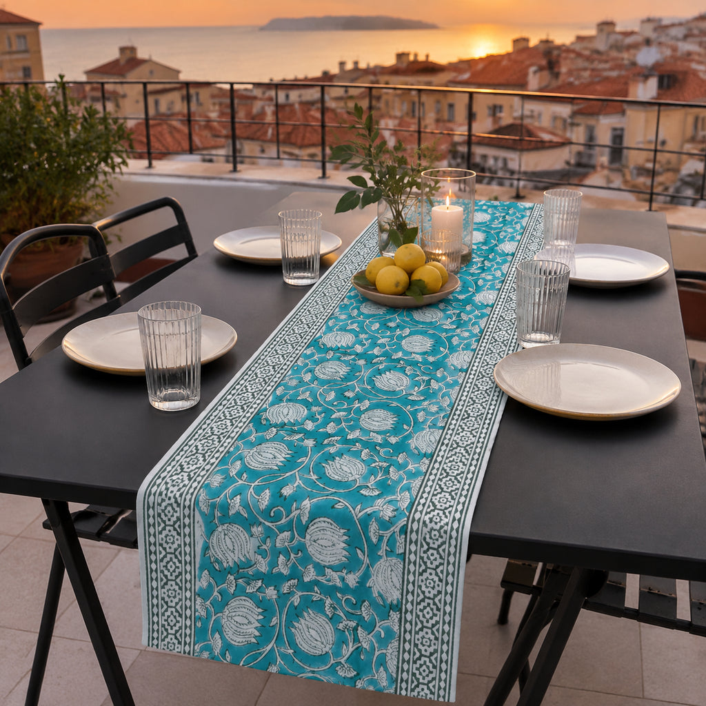 Teal Lotus Vine Table Runner, styled on a dining table.