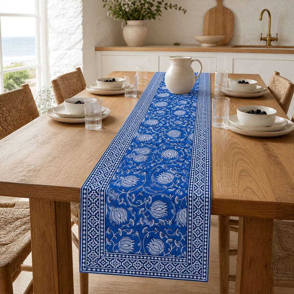 Royal Blue Lotus Vine Table Runner, styled on a dining table.