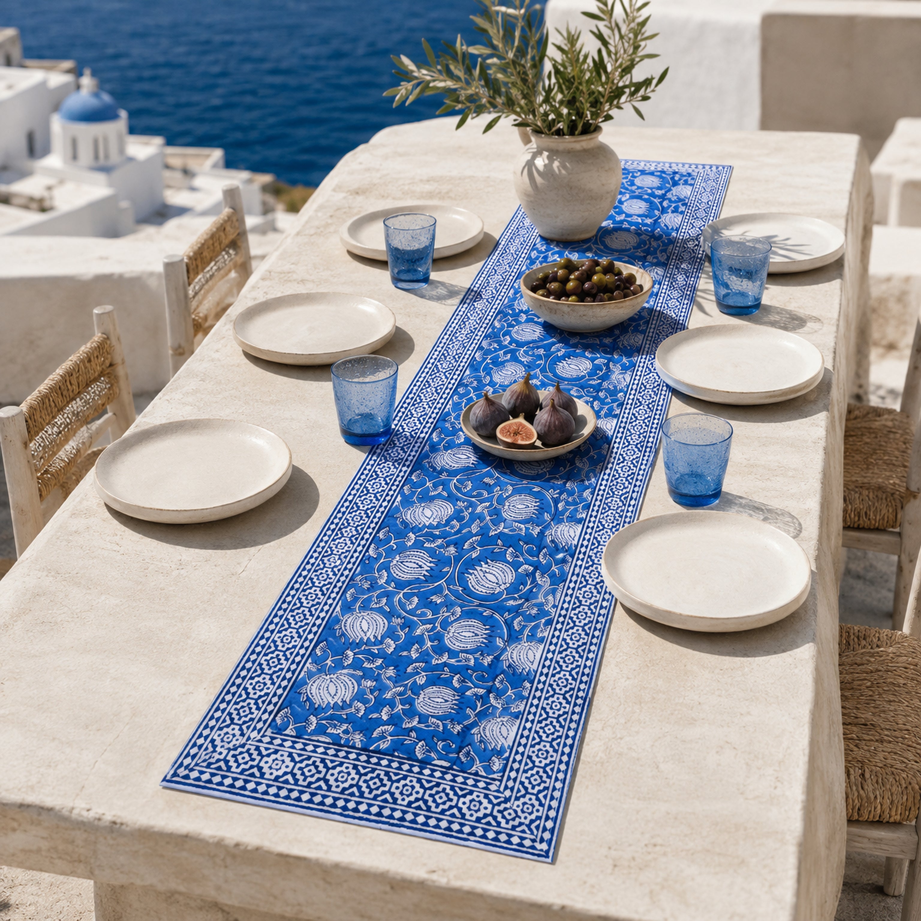 Royal Blue Lotus Vine Table Runner, styled on a dining table.