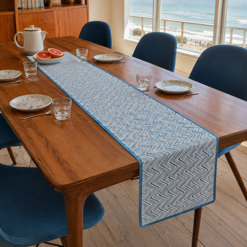 Blue Chevron Table Runner, styled on a dining table.