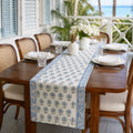 Sky Blue Palm Motif Table Runner, styled on a dining table.
