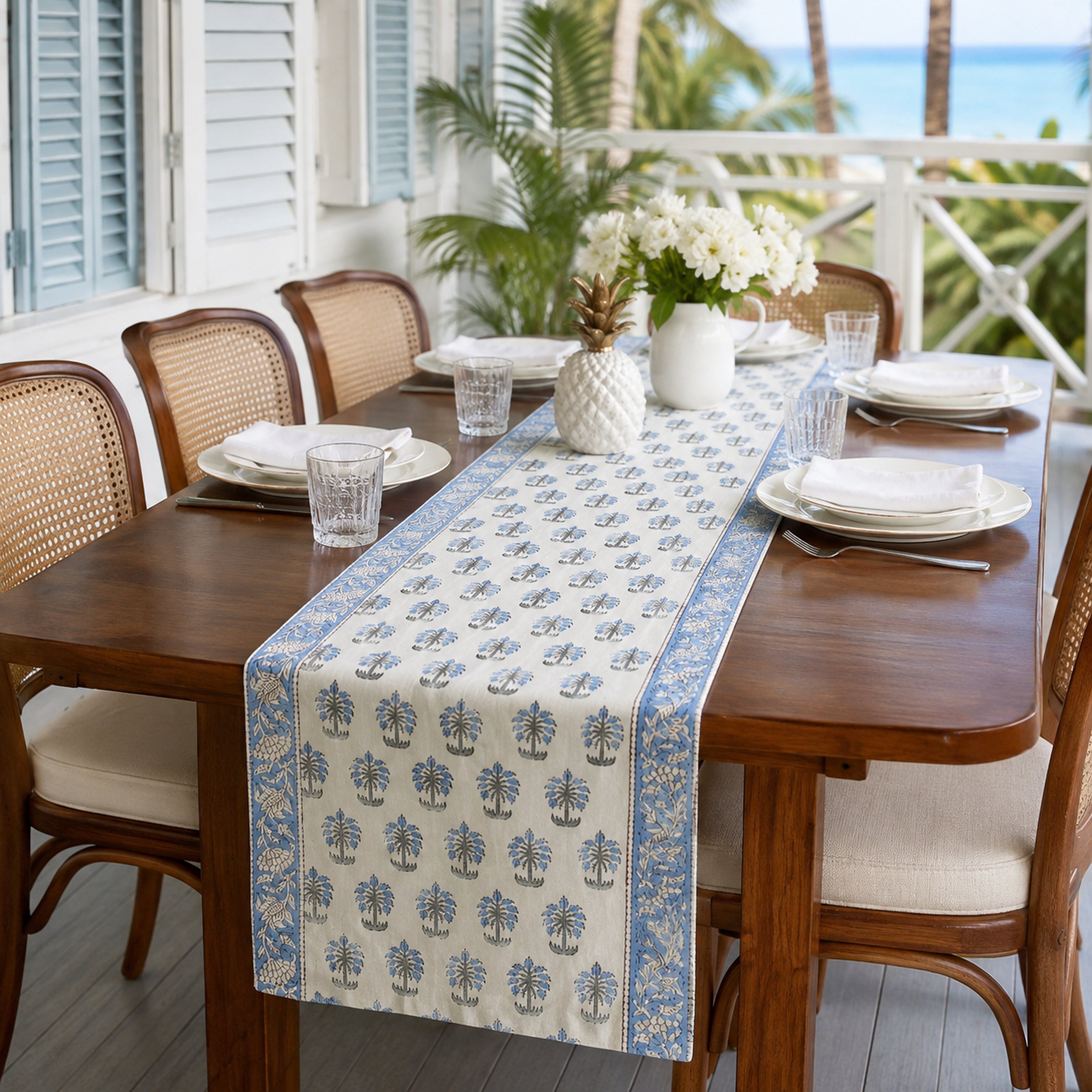 Sky Blue Palm Motif Table Runner, styled on a dining table.