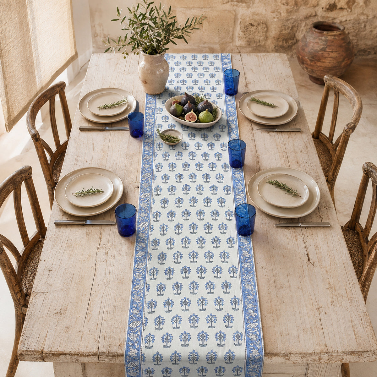Sky Blue Palm Motif Table Runner, styled on a dining table.